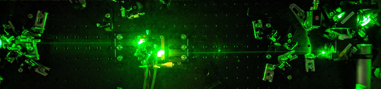 Black with glowing green shapes and lines