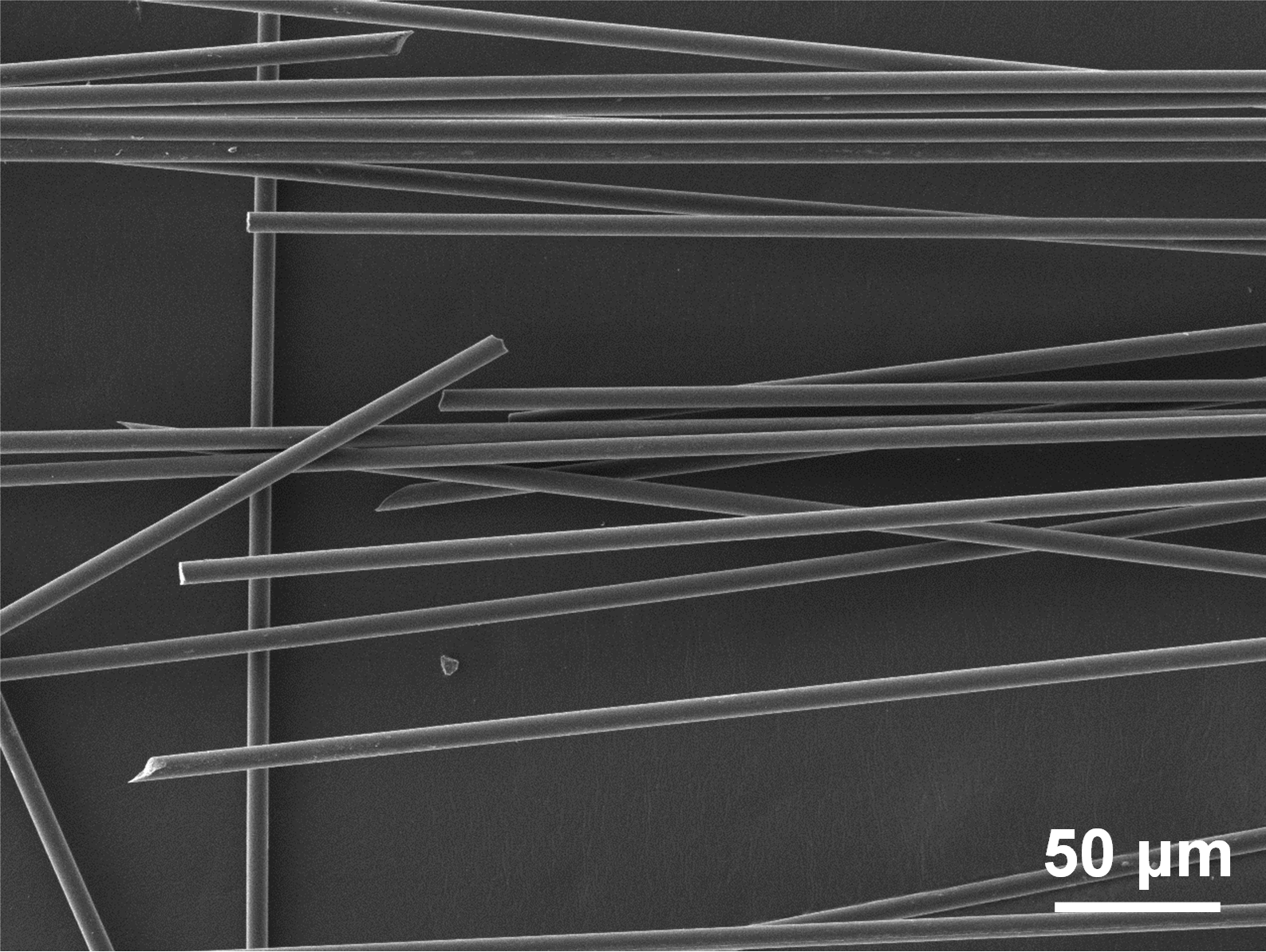 A dark gray background with lighter gray rods at various angles.
