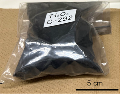 A clear plastic bag of black powder